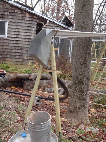 gutter catcher via 2inch black pipe to IBC